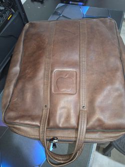Vintage Apple Carrying leather bag and books on early apple computers dos etc