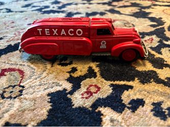 The Vintage Texaco Truck Bank is a charming and nostalgic collectible item, measuring 8.5 inches in length