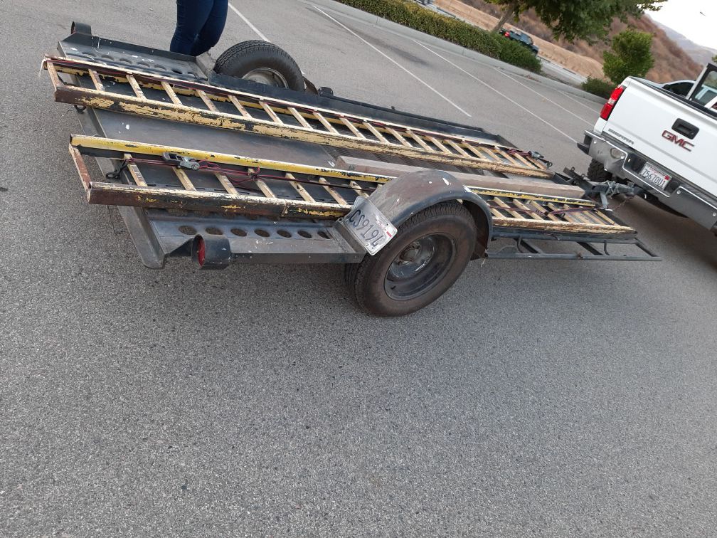 12ft trailer with ramps.