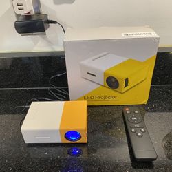 Portable Mini LED HD Projector with Remote for iPhones & Laptops