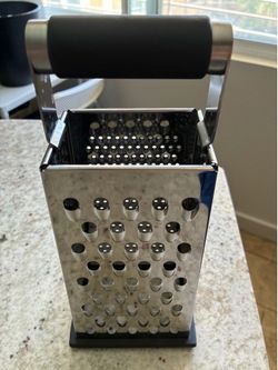 Metal cheese grater with comfortable handle
