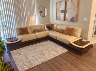 Real leather sectional sofa with walnut base