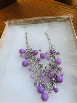 Very nice purple and silver boxed cluster necklace with purple matching earrings set.