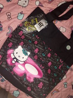 Hello Kitty x Hello Barbarian tote bag with pink skulls and lightning bolts on black background