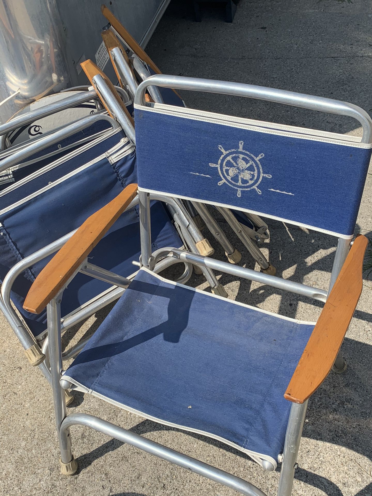 4 low profile folding chairs with matching table for the back of a boat