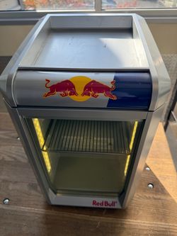 Up for sale is an authentic, commercial-grade Red Bull Baby GDC ECO LED Countertop Mini Fridge (Model: RB-GDC ECO LED). Perfect for a man cave, game r