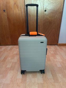Away the bigger carry -on with ejectable battery sand suitcase