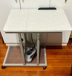 Side table with power outlets on wheels