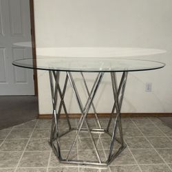 Silver 48” Round Chrome & Glass Top Table