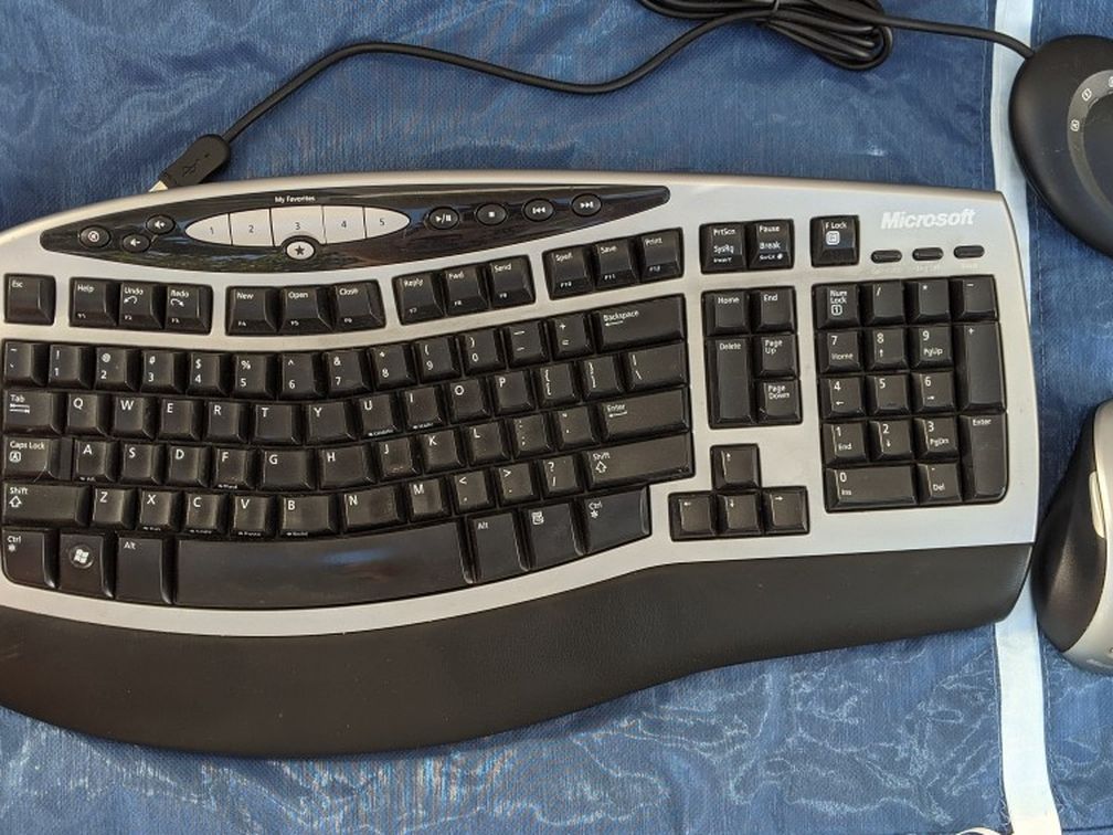 Ergonomic padded wireless keyboard and laser mouse
