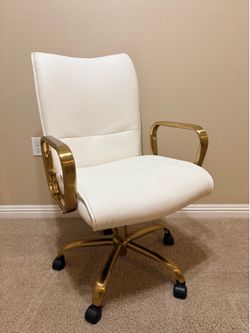 Faux white leather chair with gold accents