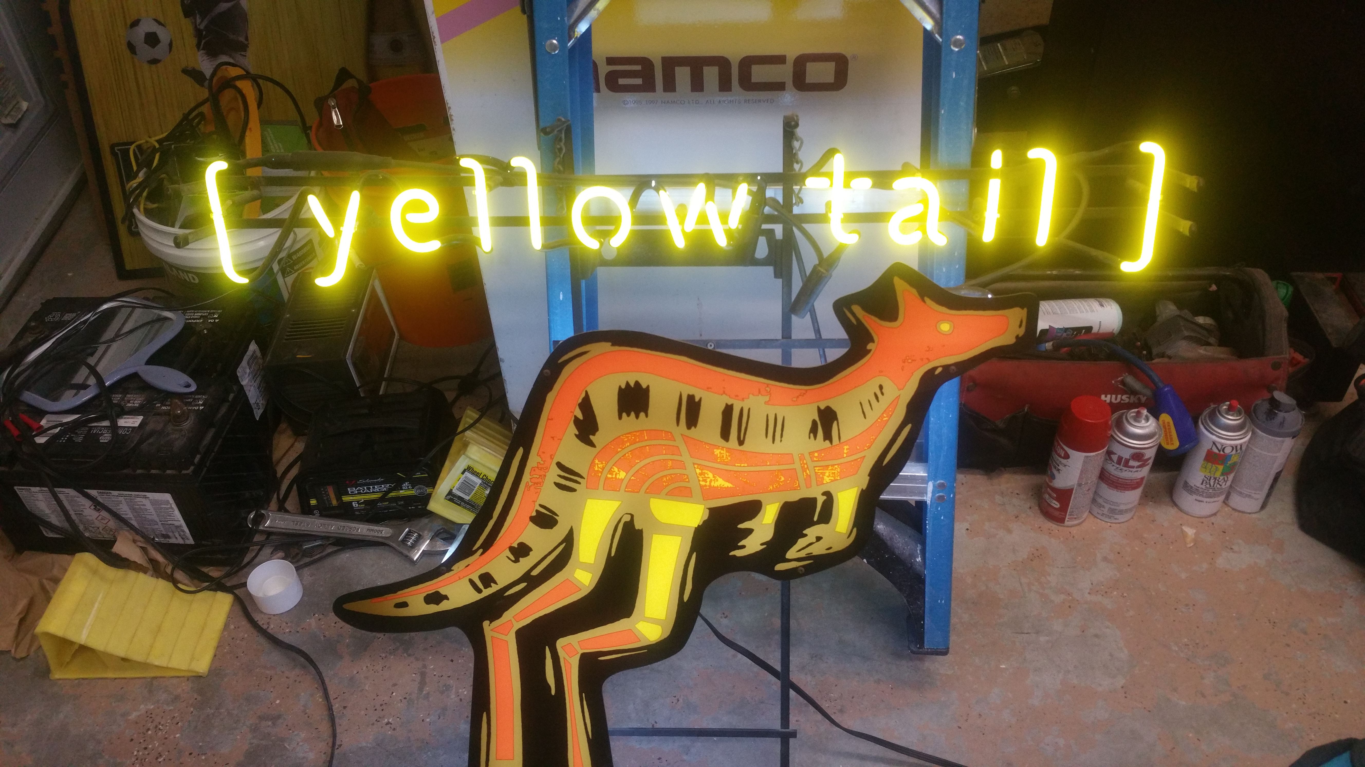 Neon yellow tail sign