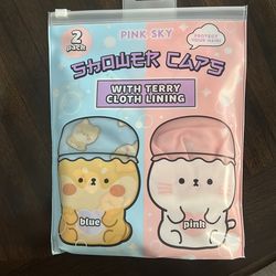 2 shower caps , pink and blue