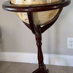Unique vintage globe on a wooden base with a solid wooden meridian holder