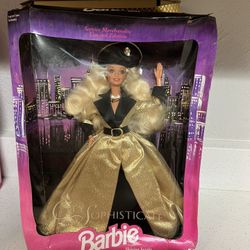 1994 Mattel City Sophisticate Limited Edition Barbie Doll.  It was a Service Merchandise exclusive, limited edition doll. The doll has blonde, wavy ha