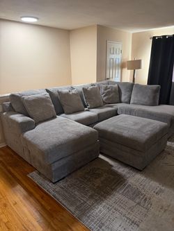 Large sectional couch Ottoman & rug included