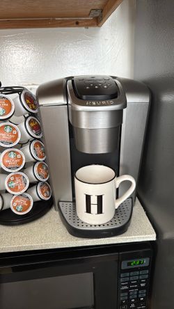 Coffee maker with pod stand
