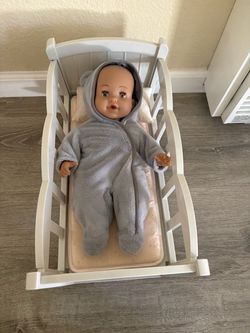 baby doll with rocking cradle