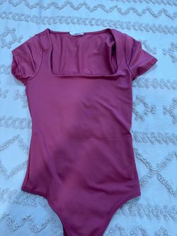 Pink woman’s bodysuit