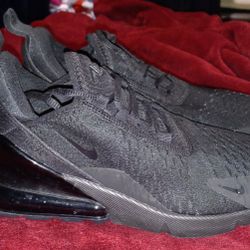 This is a Nike Air Max 270 in a triple black colorway SIZE 8. 