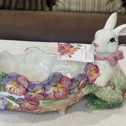 Corner Ruby ceramic bunny wheelbarrow planter with floral decoration.