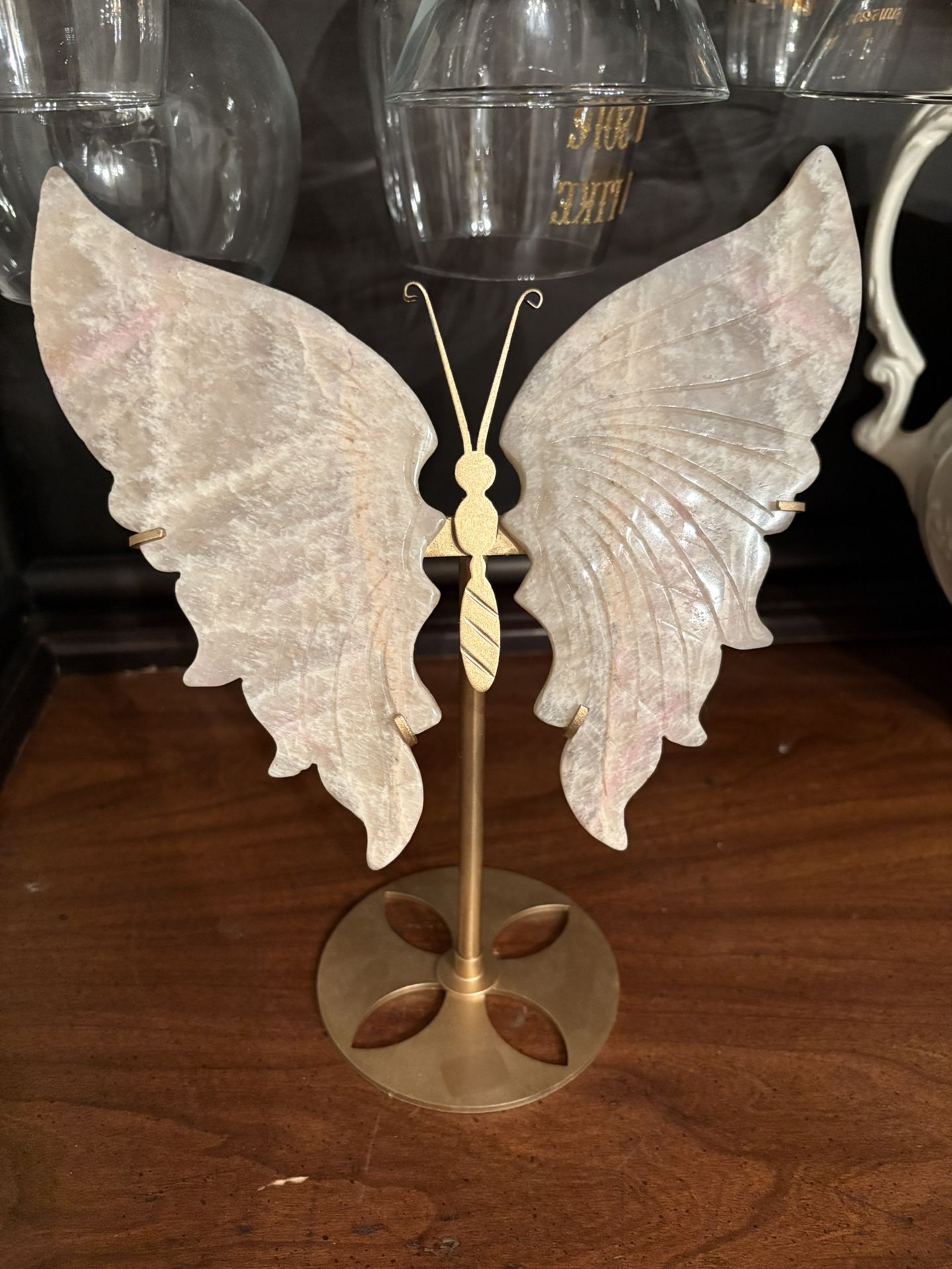 Peach moonstone butterfly wings with stand. Small amount of pink dye