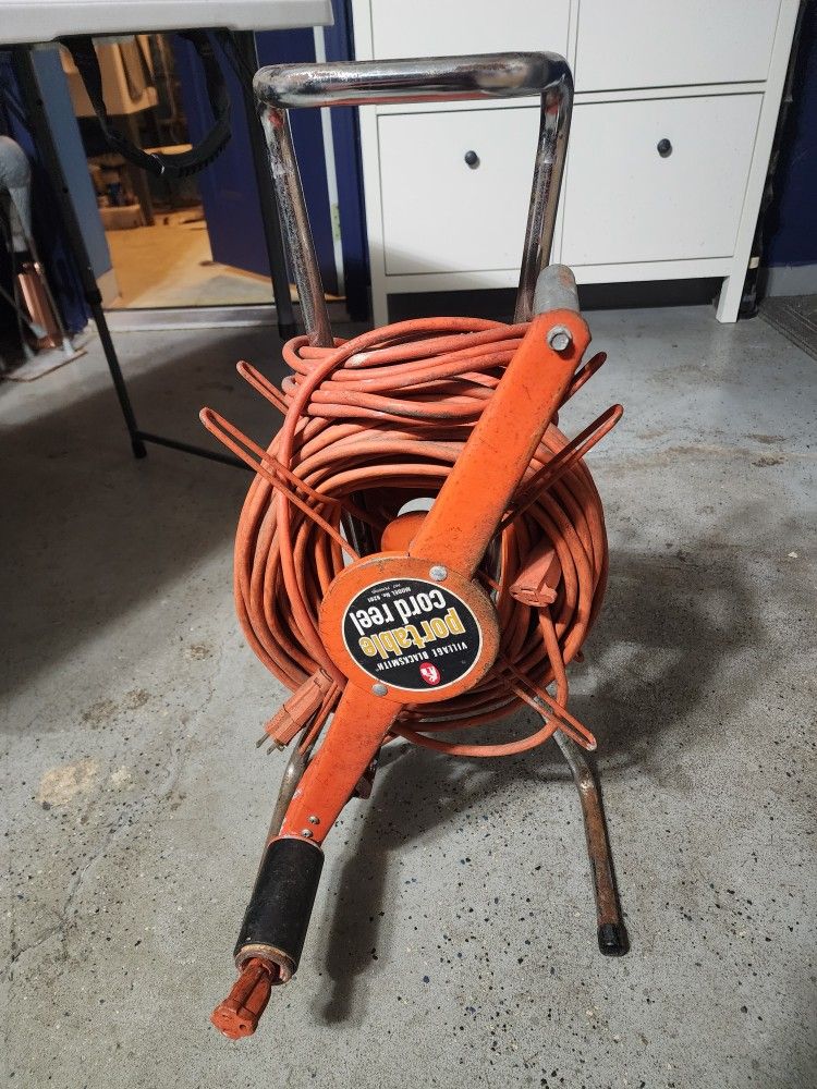Portable cord reel w/ extension cords