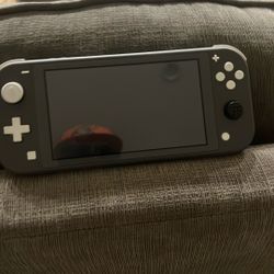 Grey Nintendo Switch Lite With Super Mario Wonder
