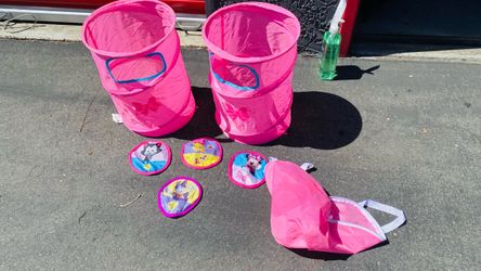 A couple of toy hampers or dirty clothes hampers