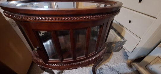 Vintage oval  tea/ liquor cabinet with glass