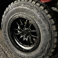 18x9 Wheels And Tires 275/70/18 Toyo RT