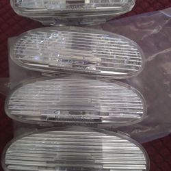 Caps for running board lights