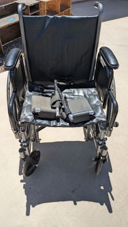 Located in Albuquerque NM. Wheelchair with footrests