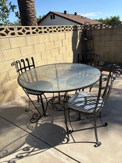 Wrought iron vintage patio set with 4 chairs