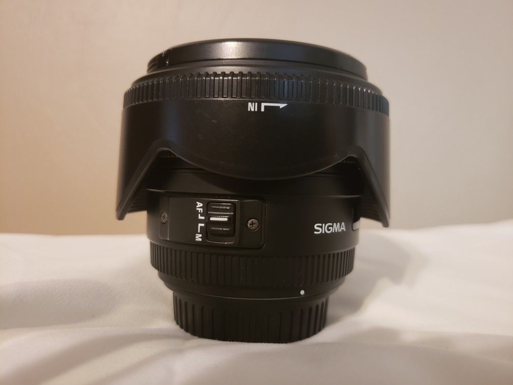 Sigma 50 mm non-Art lens. Some great portraits have been taken with this lens. $200 OBO