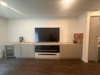 Custom Cabinet with Wine Fridge and Fireplace