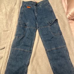 Empyre dark blue washed cargo and it’s a size 27 in youth