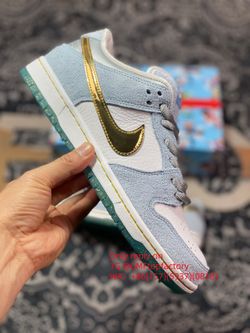 Sean Cliver x NK SB Dunk Low Holiday Special