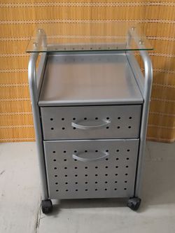 Metal filing cabinet with wheels and glass