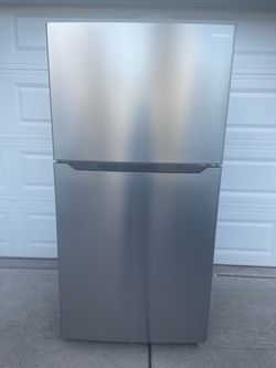 Insignia stainless steel top and bottom refrigerator for $380. Dimensions are 33Wx32Dx66H. Pick up only.