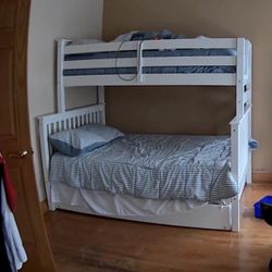 Twin/Full Bunk bed with trundle, tall dresser and kids table.