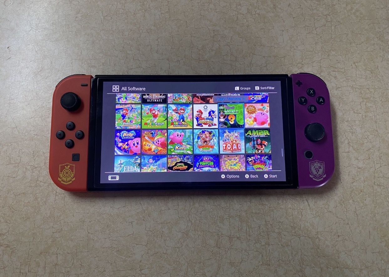 NINTENDO SWITCH OLED BERSION with 125 SWITCH GAMES and 7500 RETRO CLASSIC GAMES