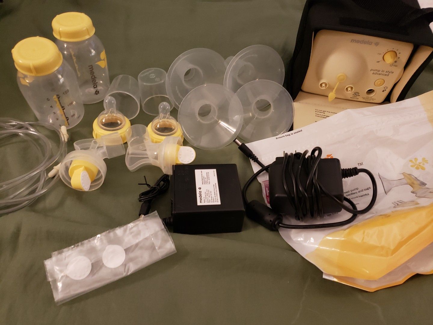 Medela breast pump. Almost new, I only used this pump for less than a week, like 4 or 5 times. Comes with Kaiser diaper bag.