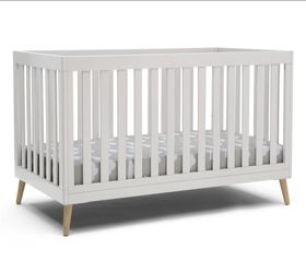 Delta Children Essex 4-in-1 Convertible Baby Crib, Bianca White with Natural Legs