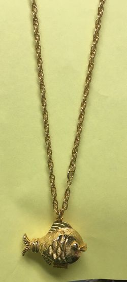 Gold tone chain with fish locket
