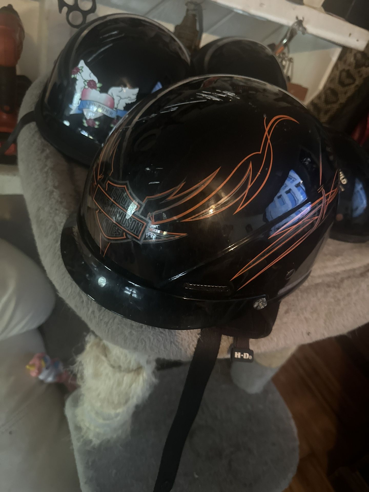 Motorcycle helmets, size, large, and one women’s medium
