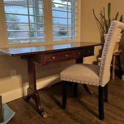 Mohagany Drop Down Leaf Desk With Brass Accent Casters