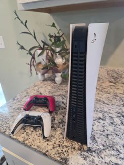PS5 and 2 Controllers