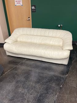Cream-Colored Leather Sofa with Unique Design