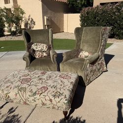 Two well-loved chairs, three pillows and ottoman.